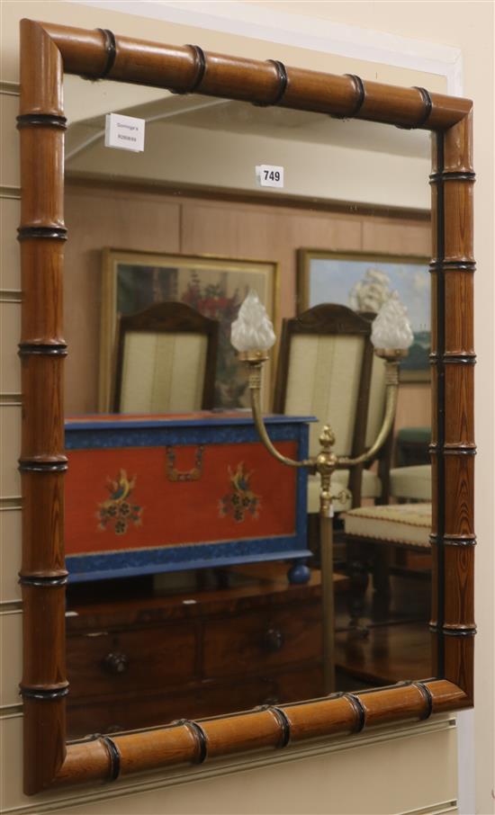 A bamboo framed wall mirror H.74cm
